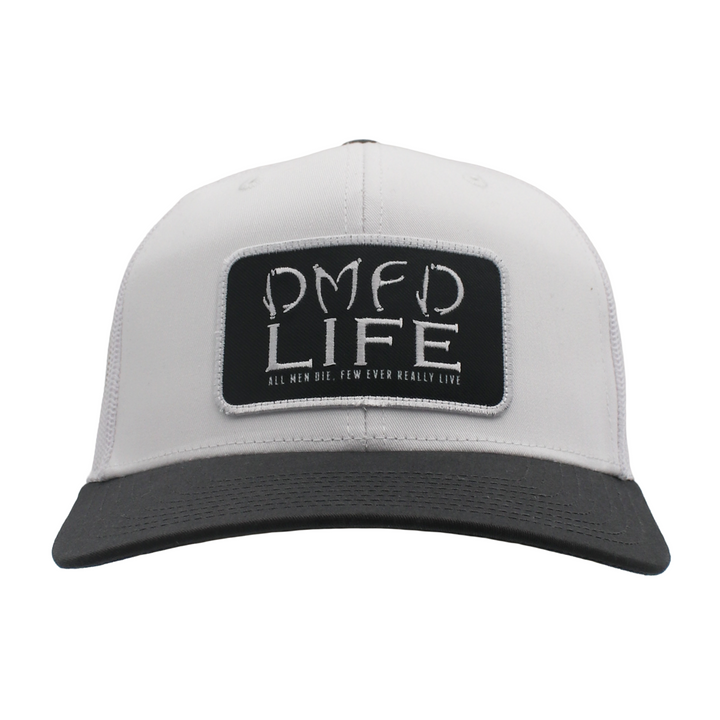 A white hat with a grey bill and a black patch on the front that says "DMFD LIFE" in white