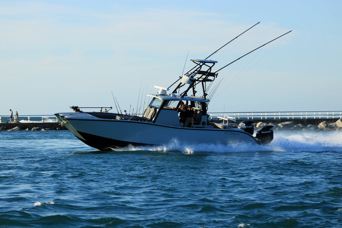 Insetta Charter Fishing boat on the water headed out with DMFD Life charter fishing clients