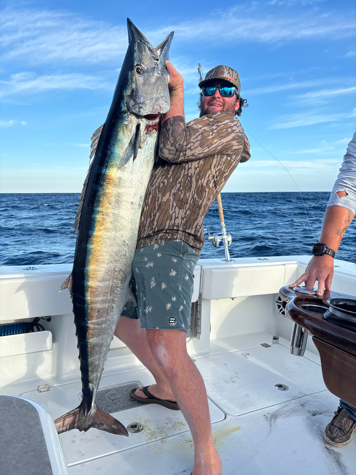 Person holding a large fish on a DMFD Life Insetta 35IFC "Forty 1" Charter Fishing boat