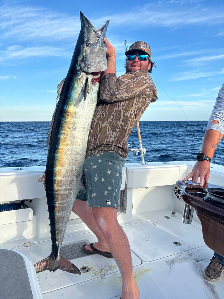 Person holding a large fish on a DMFD Life Insetta 35IFC "Forty 1" Charter Fishing boat